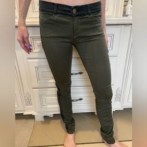 Green stretchy pants with black stripe down the side.